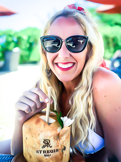 Kat drinking a coco at St Regis Bali